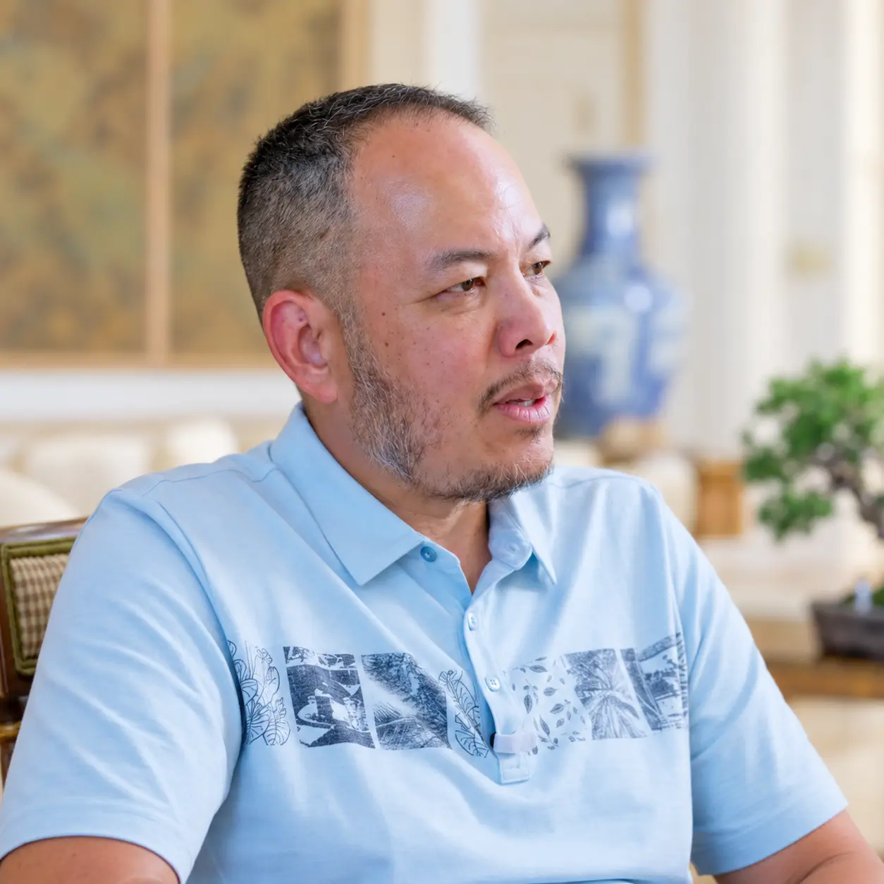 John Barrera in a light blue shirt
